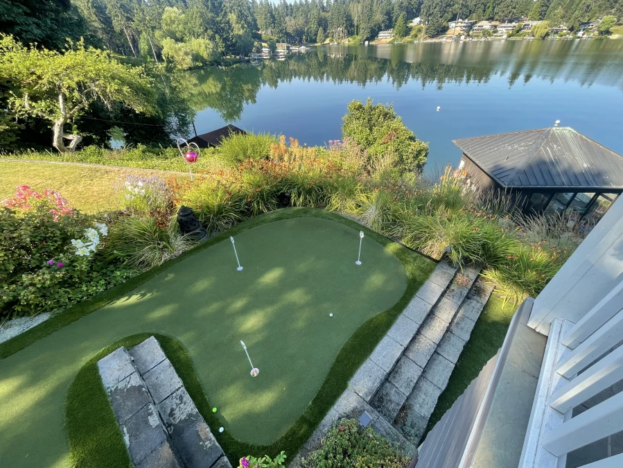 A fun artificial turf putting green with fringe installed overlooking the lake in Lakewood, WA.