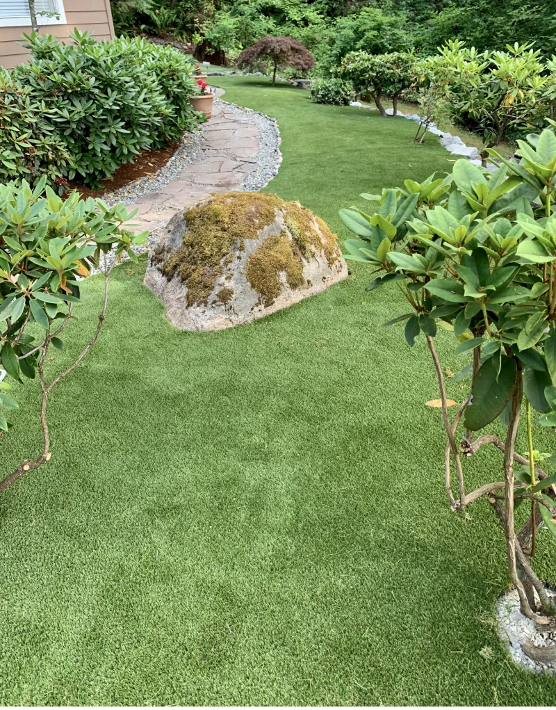 Natural Looking Artificial Grass Installation with Rock border