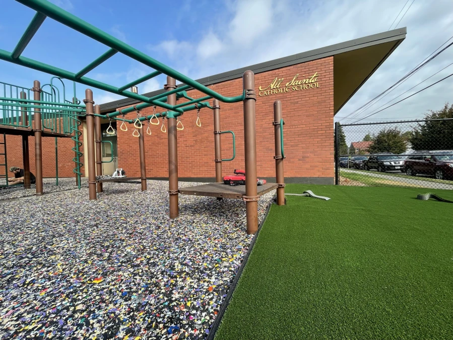 Example of synthetic turf playground installed over 2 inch playground pad for fall height.