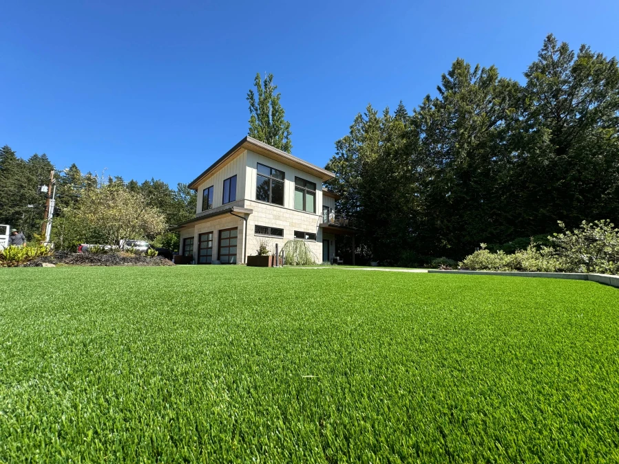 Pristine synthetic turf lawn installation next to golf course in Gig Harbor, Washington State showcasing professional landscaping